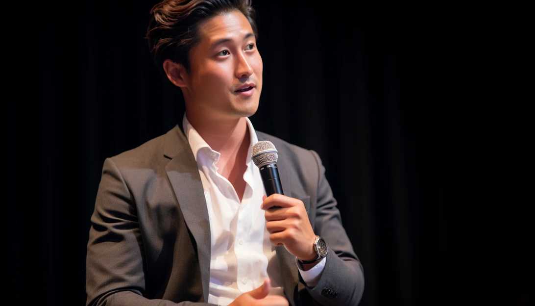 A photo of Andy Ngo speaking at a journalism event, taken with a Canon EOS 5D Mark IV