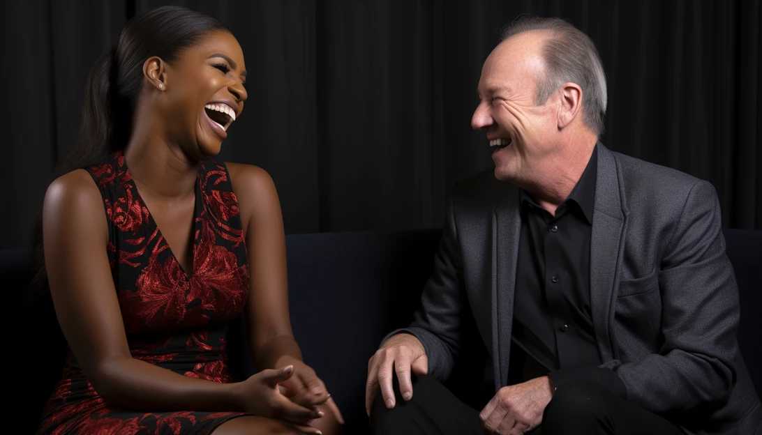 A close-up shot of Gerry Turner and Jennifer Hudson laughing together during their interview.